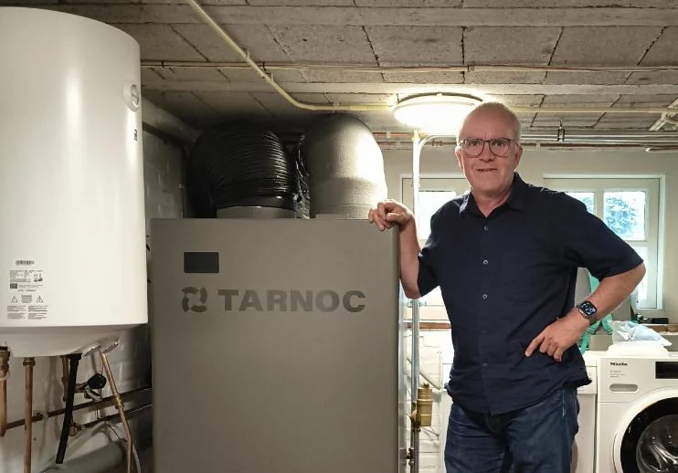 Bernard Vercouteren next to the Turbine Heat Pump in De Vergulde Schoe